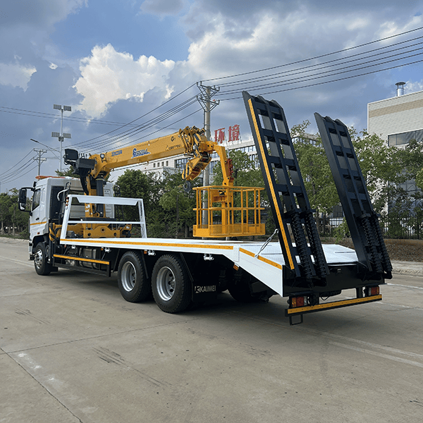 Multi-functional flatbed transport truck with a mobile crane