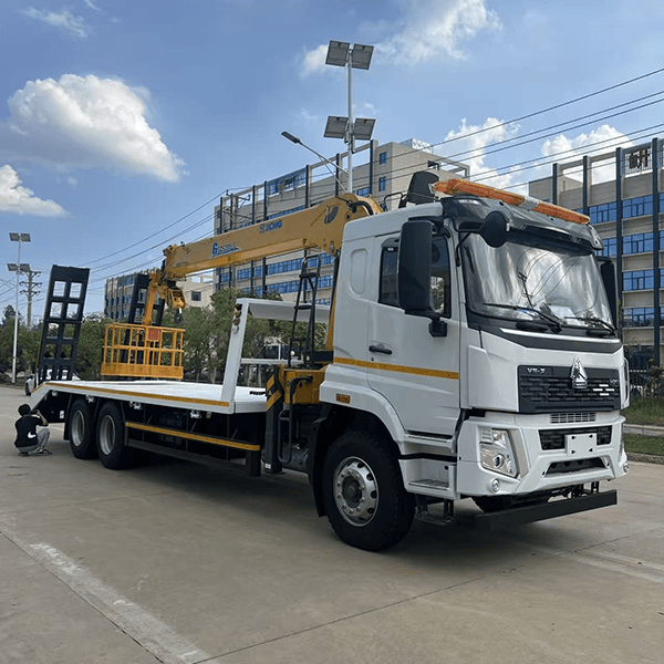 Multi-functional flatbed transport truck with a mobile crane