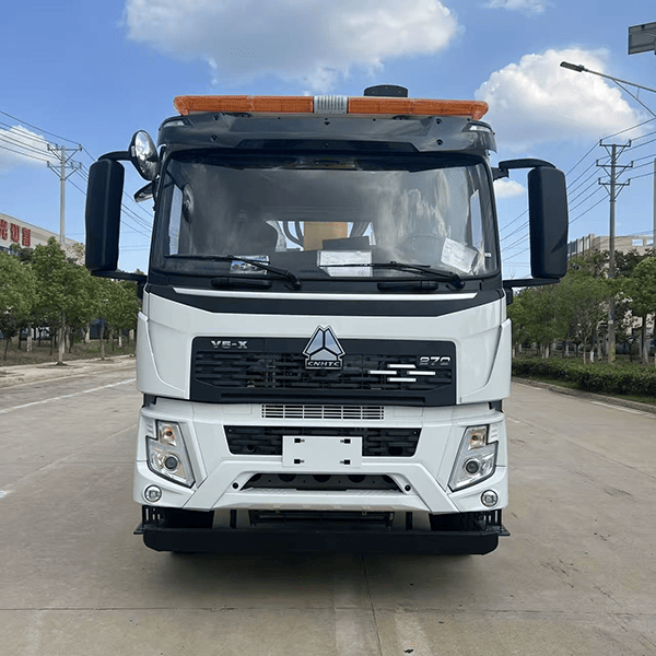 Multi-functional flatbed transport truck with a mobile crane